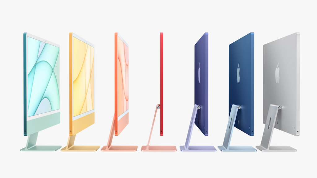 Siete iMac de diferentes colores de pie sobre un fondo blanco, vista lateral, posterior y frontal Una iMac rosa claro que marca la pantalla de inicio de pie sobre un fondo blanco