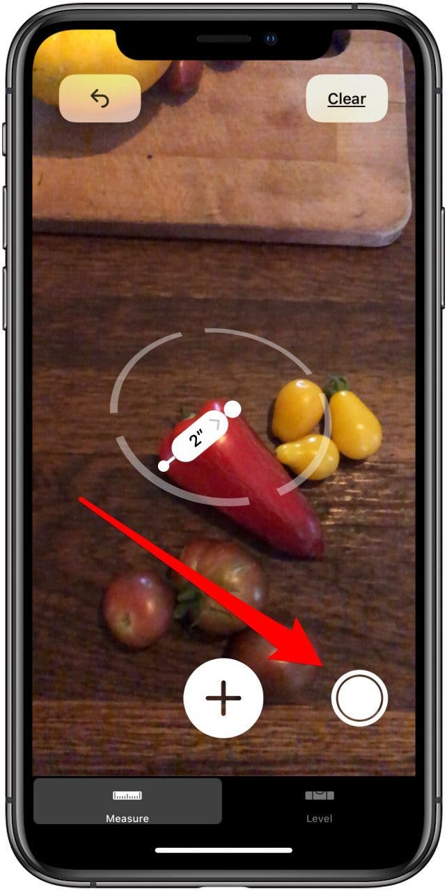 appuyez sur le bouton de l'obturateur pour prendre une photo de la mesure de l'application de mesure