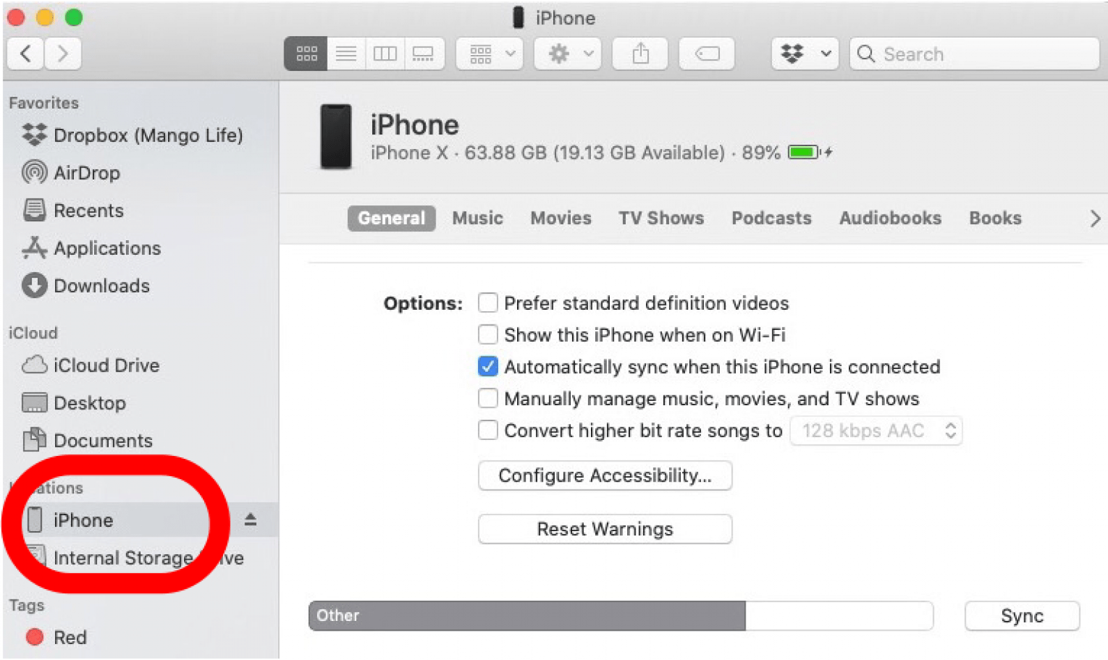 cliquez sur votre iPhone sous Emplacements dans le Finder