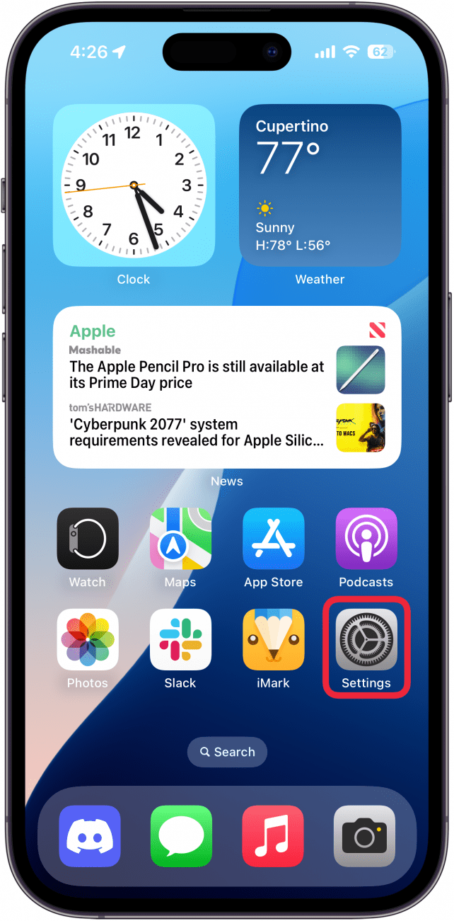 Une capture d'écran de l'écran d'accueil de l'iPhone avec une boîte rouge autour de l'application Paramètres